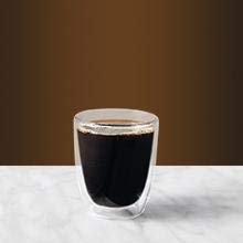    A cup of coffee of black brown color